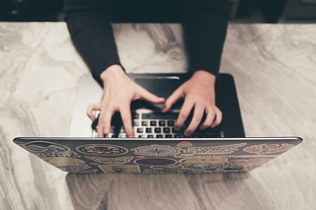 person typing on black laptop computer thumbnail