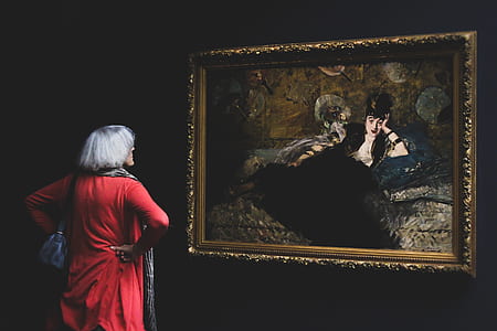 man looking at painting thumbnail
