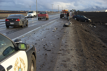 vehicles on asphalt road under cloudy sky during daytime thumbnail