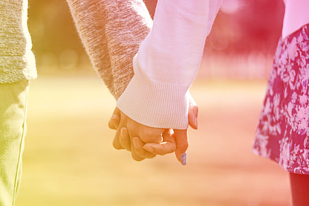 man and woman holding hands thumbnail