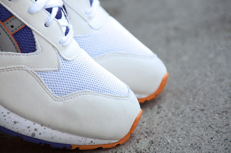 close-up pair of white running shoes thumbnail