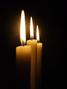 scenery of three yellow wax candles thumbnail