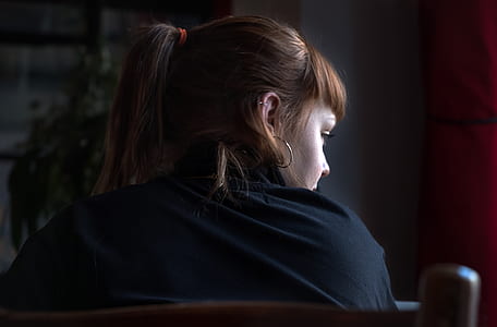 person taking photo of woman wearing black top thumbnail