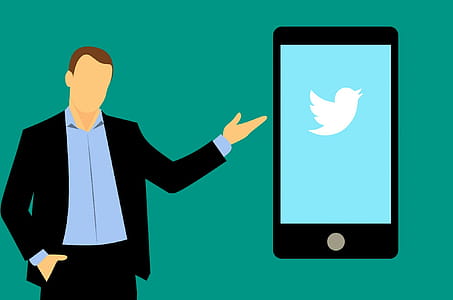 Social media guy with mobile device running twitter app. thumbnail