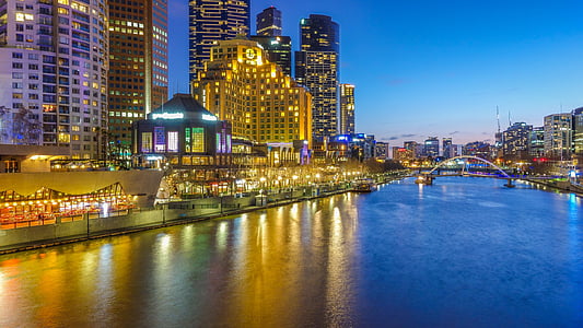 photo of city lights reflection on top of body of water during nighttime thumbnail