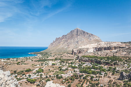 mountain near body of water panoramic photography thumbnail