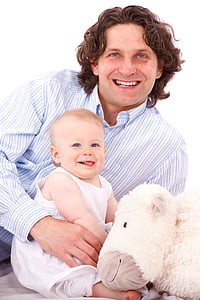 man holding baby wearing white sleeveless shirt beside white animal plush toy thumbnail