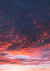 low angle photography of black and red clouds thumbnail