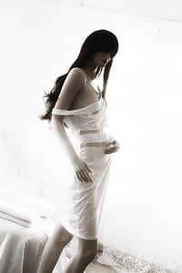 woman mannequin standing beside window thumbnail