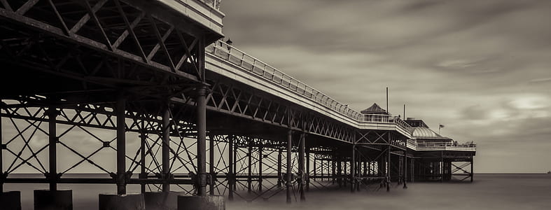 gray steel bridge on body of water thumbnail