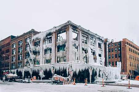 architectural photography of white and brown buildings under gray sky at daytime thumbnail