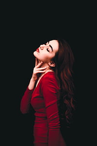 close up photograph of woman in red long-sleeved shirt thumbnail