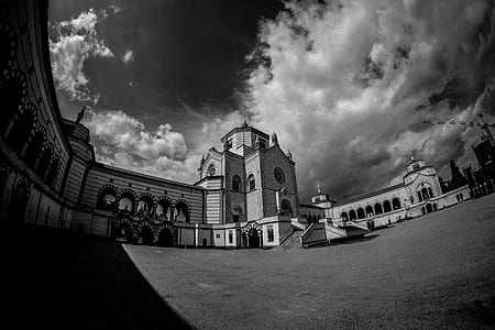 Black and White Photo of Cemetery Under White Cloudy Sky thumbnail