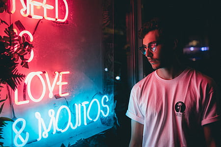 man standing near neon light signage thumbnail