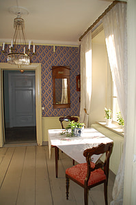 wooden table with plant near window thumbnail