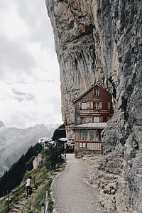 Brown Wooden House on Edge of Cliff thumbnail