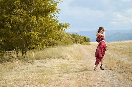 woman wearing red and white polka-dot dress thumbnail