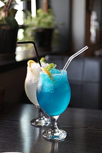 two clear liquor glasses on table thumbnail