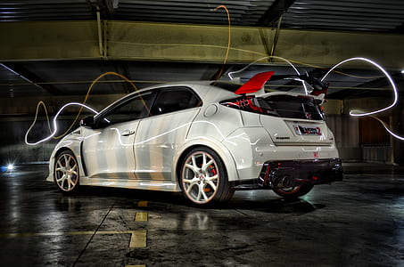 silver hatchback parked in garage thumbnail