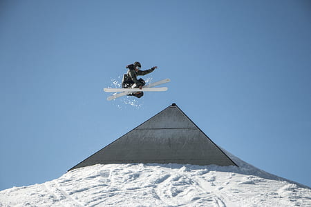 person on air skiing above snow covered slope thumbnail