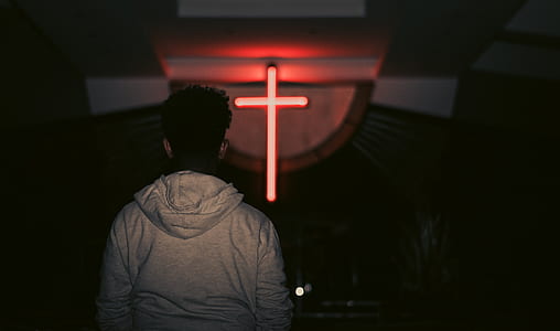 man standing in front of church thumbnail