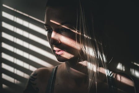 woman looking at window thumbnail