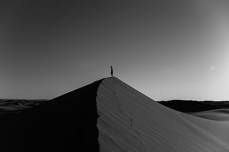 person standing on desert sand thumbnail