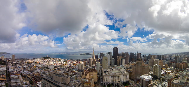 aerial photography of city buildings under white clouds during daytime thumbnail