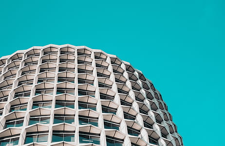 white concrete building under blue sky during daytime thumbnail