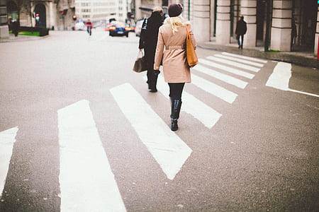 woman walking on pedestrian lane thumbnail