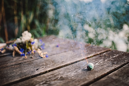 Colorful smoke bomb, book and vintage camera thumbnail