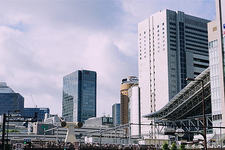 white wall paint high-rise building during daytime thumbnail