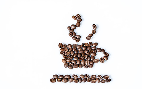 brown coffee beans on white surface thumbnail