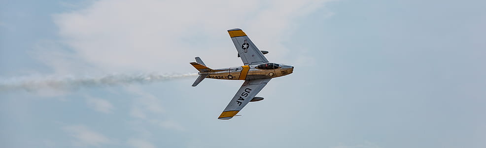 brown and gray plane at the sky during daytime thumbnail