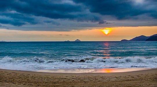 panoramic photography of shore under sunrise thumbnail