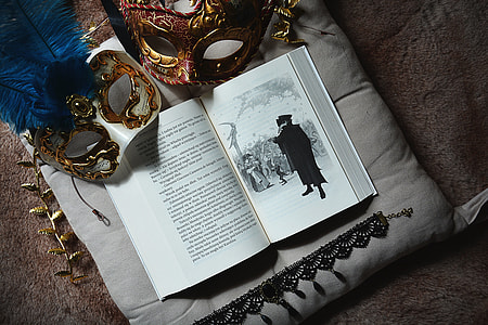 opened book and masquerades thumbnail