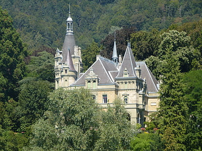 beige and gray concrete castle surrounded with green trees at daytime thumbnail