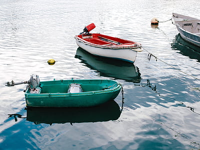 green and white kayak on the body of water thumbnail