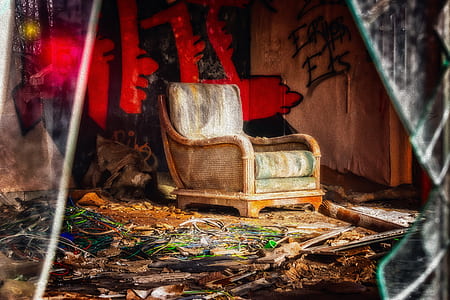 green and white padded armchair thumbnail