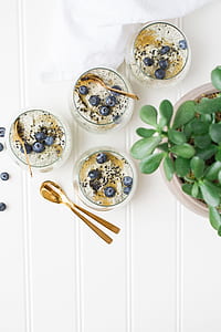 flat lay photography of cereals with blue berries thumbnail