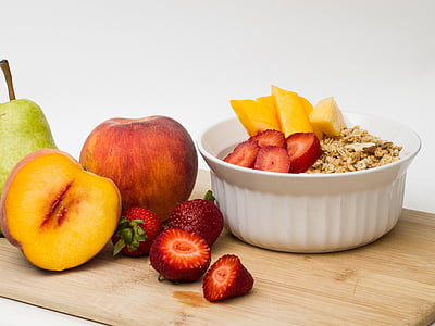 sliced strawberries and apples on top of cereal thumbnail