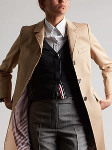 person wearing brown leather coat thumbnail