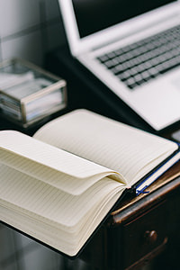 Elegant workspace with Macbook, iPhone, business cards and notebooks thumbnail