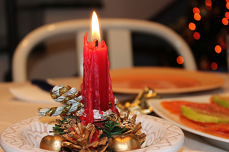 lighted red taper candle thumbnail