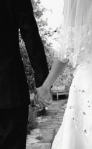 man and woman holding hands together thumbnail
