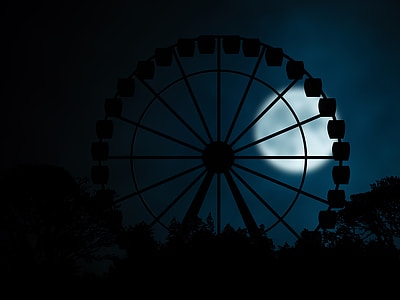 silhouette photography of Ferris wheel under moonlight thumbnail