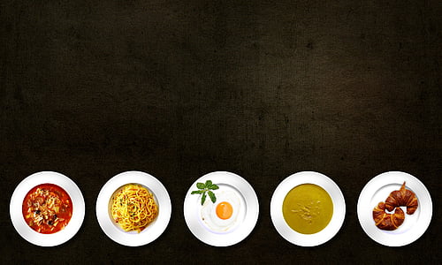 five assorted dishes on round white ceramic plates thumbnail