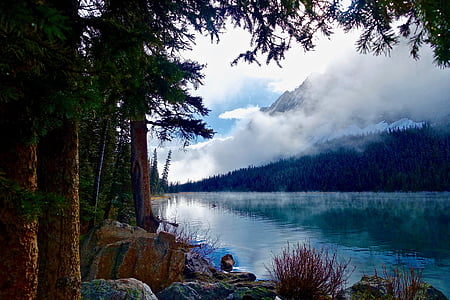 gray mountain with sky mirrored into water thumbnail
