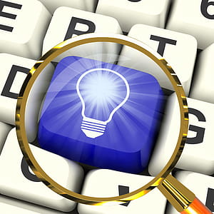 Light bulb Key Magnified Meaning Bright Idea Innovation Or Invention thumbnail