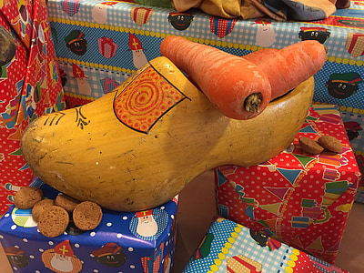 three carrots on wooden shoe thumbnail